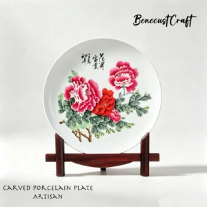 Hand-carved porcelain plate with peony design, symbol of wealth and honor, by BenecustCraft.