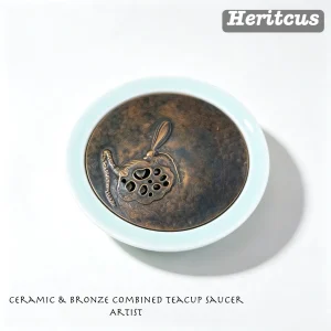 Ceramic and hammered copper combination teacup saucer, mixed-material design with engraved copper rim and ceramic center, by Heritage & Craft.