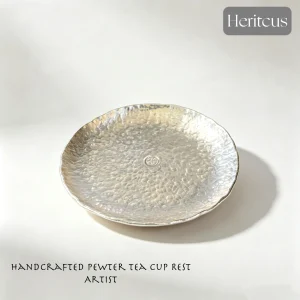 Hammered tin teacup saucer with handcrafted textured surface, traditional Chinese tea accessory, by Heritage & Craft.