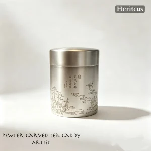 Hand-engraved tin tea caddy with traditional Chinese motifs, overall view of carved metal craft, by Heritage & Craft.