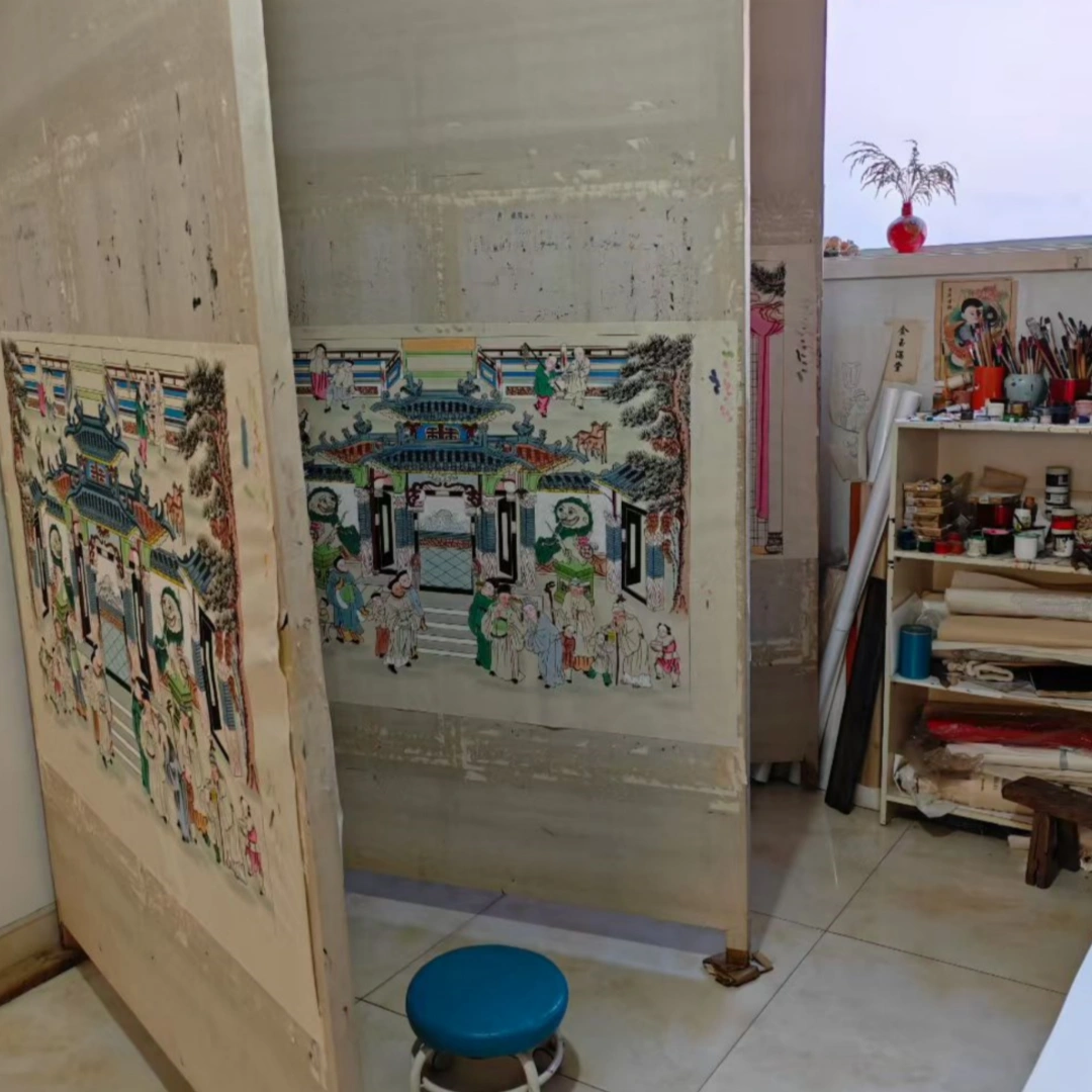 Artisan painting in Gaomi Puhui studio workshop, traditional New Year folk art creation environment, by Heritage & Craft.