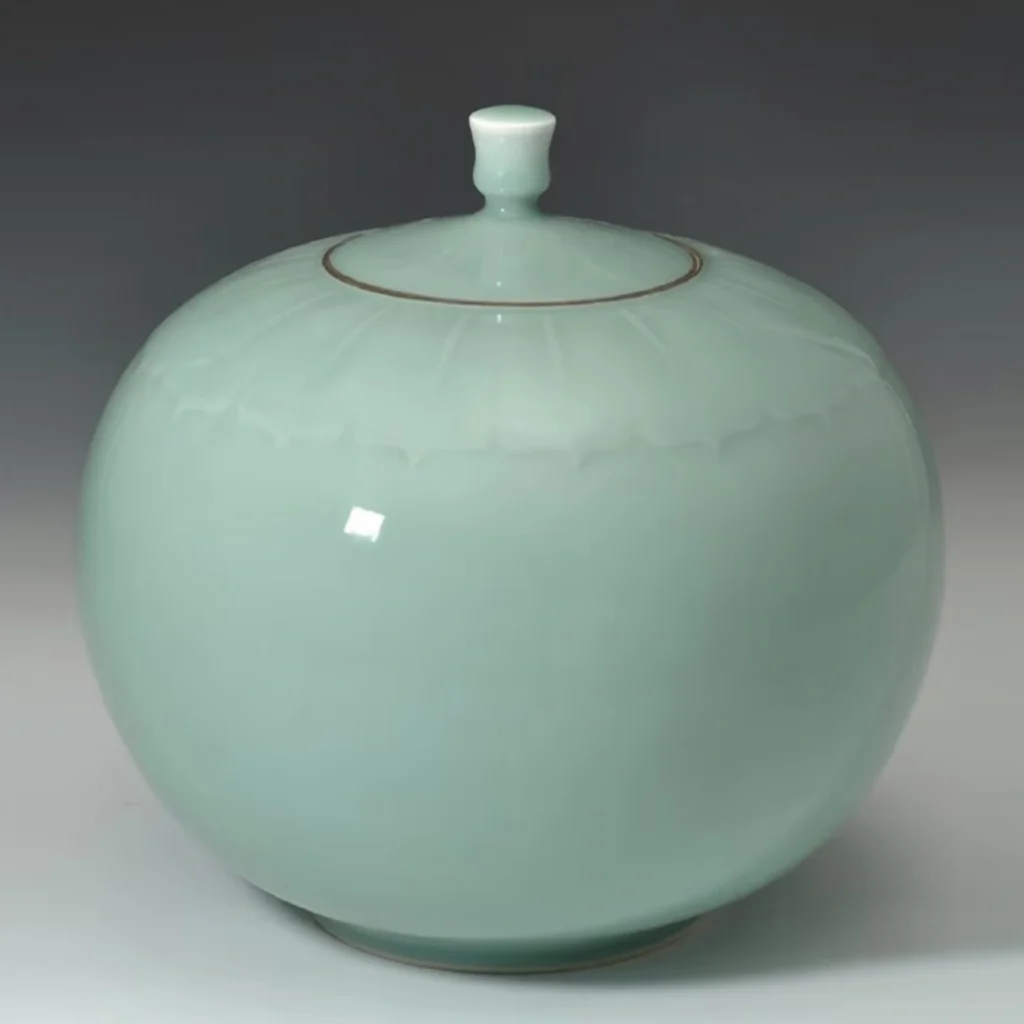 Handcrafted Luqing celadon porcelain vase with carved floral pattern, finished ceramic artwork, by Heritage & Craft.