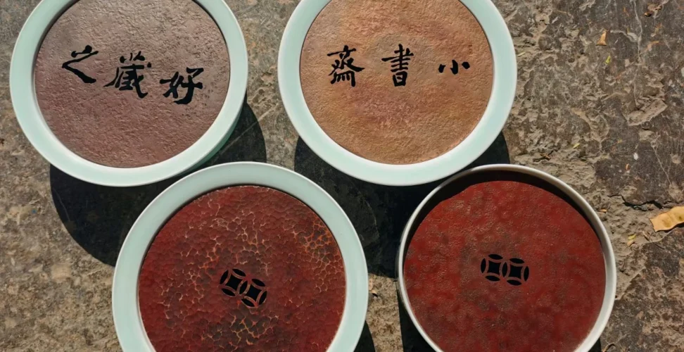 Collection of ceramic and hammered copper combination teacup coasters in multiple styles and patterns, gongfu tea set